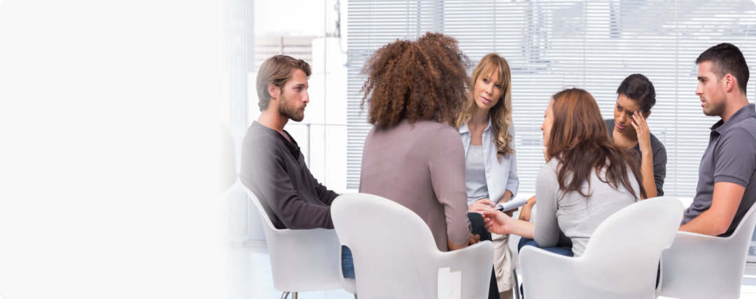 people talking in a group therapy