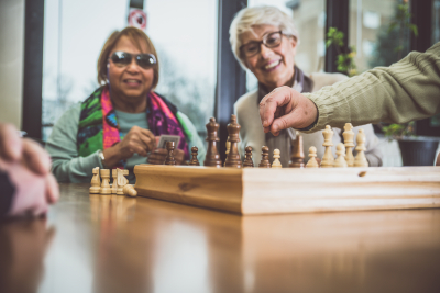 Group of seniors making activities inside the hospice